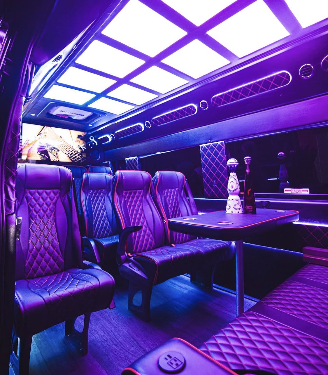 Starlight Sprinter interior, diamond-quilted seating and a lit ceiling around the center table
